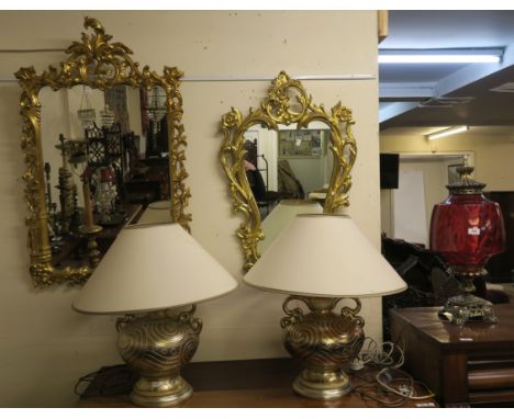 A pair of Gregory's Ltd golden ceramic table lamps, cranberry glass shaded metal based table lamp and two modern gilt framed 