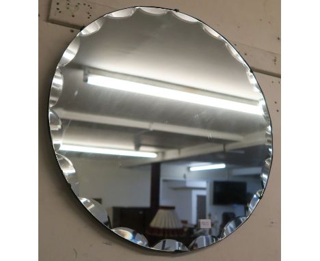 A 20th century frameless circular mirror and a sled (2) Condition Report: Available upon request