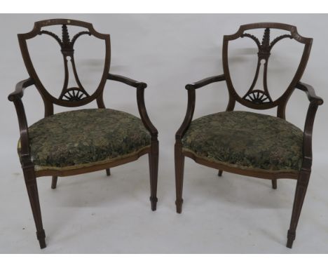 A pair of Victorian mahogany framed armchair with floral tapestry seats on tapering supports 97cm high (2) Condition Report: 