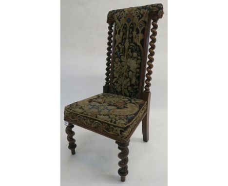 A Victorian oak Prie Dieu chair with tapestry upholstery on barley twist supports, 92cm high Condition Report: Available upon