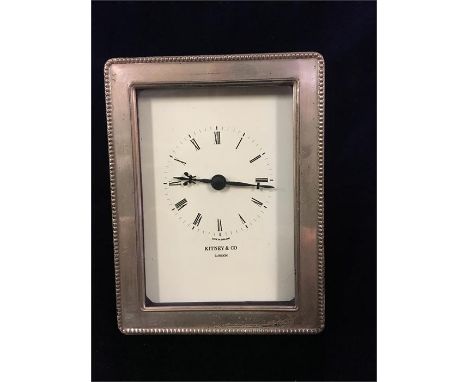 A Kitney & Co silver framed clock