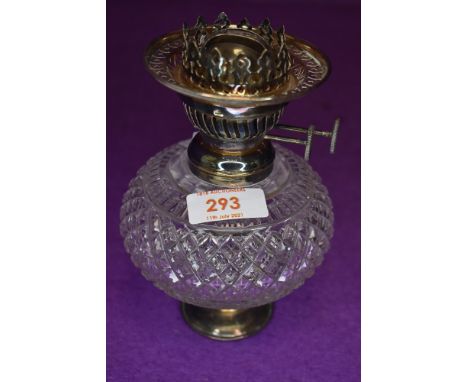 A well formed small size late Victorian oil burning lamp by Vereds having cut glass well