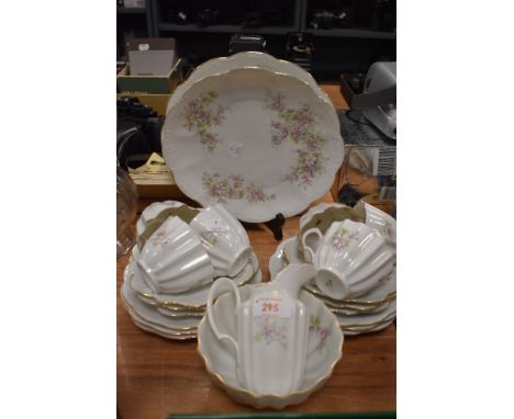 A collection of vintage cups and saucers, plates, bowl and jug having dainty floral pattern and fluted edges with gilt detail