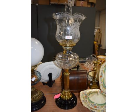 An elegant and fine antique oil burning lamp having fluted and etched shade with Roman column set an cut glass well
No visibl