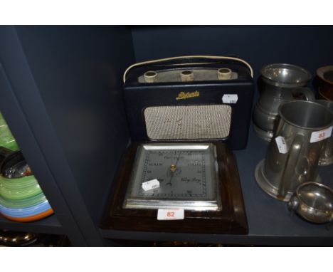 A vintage Roberts radio having deep blue vinyl case and an oak cased square barrometer