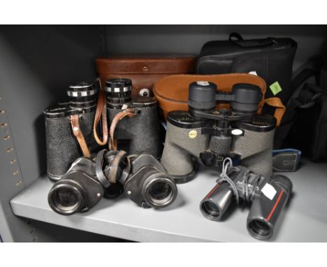 Four sets of binoculars. A swift Audubon 8.5x44 extra wide, a Swift Audubon 8.5x44, a pair of Barr &amp; Stroud 6x 10 and a p