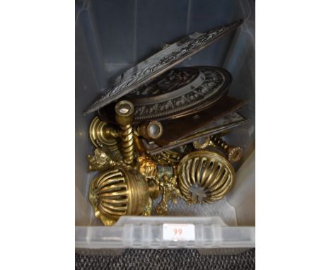 A box of vintage brass amongst which are four embossed plaques having phrases and sayings, chargers, candle sticks and more.