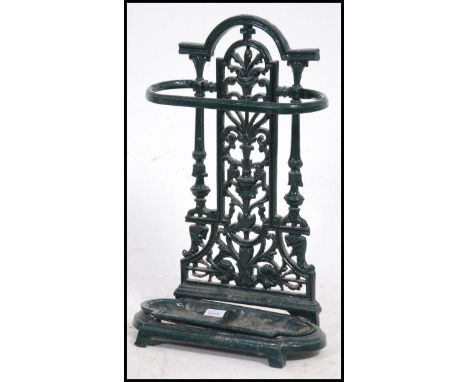 A 20th century Coalbrookdale stick / umbrella stand in cast iron with painted white finish. The tray to base with rococo upri