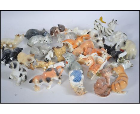 A large collection of miniature ceramic cats from the Danbury Mint ' New Cats of Character ' series
