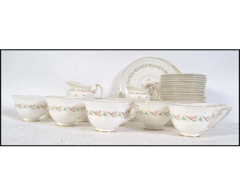 A Royal Doulton tea service in the ' Golden Spice ' pattern no H4917 comprising cups, saucers, plates etc