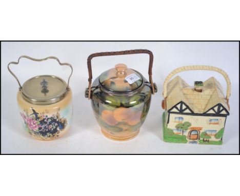 A group of three vintage late 19th / early 20th century ceramic biscuit barrels. Each with lids and handles with examples fro