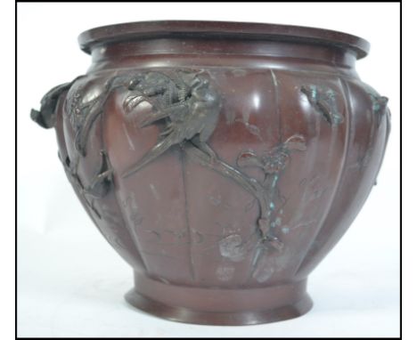 A late 19th century Japanese bronze planter decorated with swllos and fauna please see images.