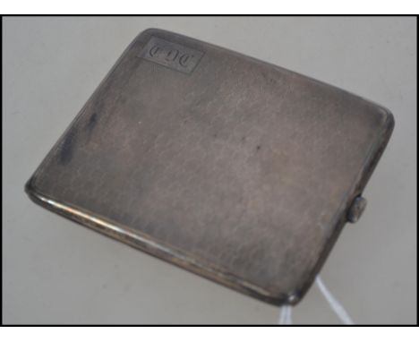 A silver hallmarked engine turned cigarette case. Having Birmingham assay marks, makers marks for Deacon and Francis and dati