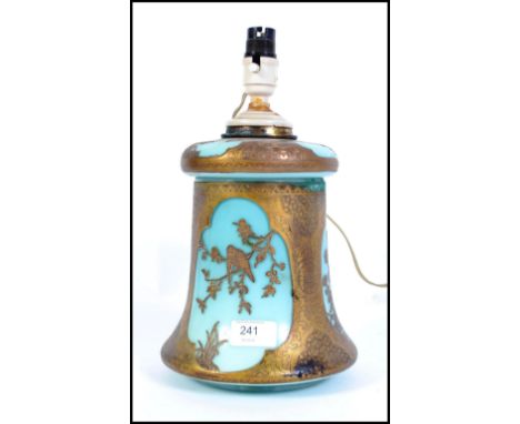 A Victorian aesthetic movement blue glass and brass mounted lamp ( converted oil lamp ) with stunning fret worked brass birds