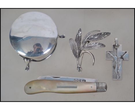 A collection of silver hallmarked items to include a mother of pearl silver bladed fruit knife with Sheffield assay mark and 