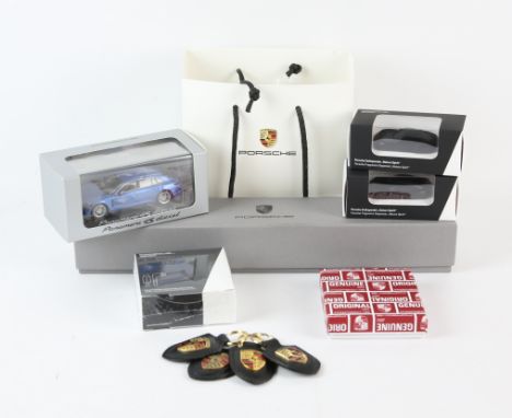 Collection of Porsche items, all new and boxed gift shop items - To include, Umbrella, Key Wallet, Panamera 1:43 model, two f