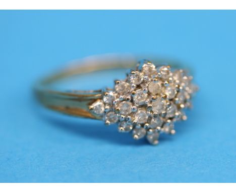 A 9ct gold cluster ring set with 25 diamonds, total approx. 0.5 carat.  Ring size R.