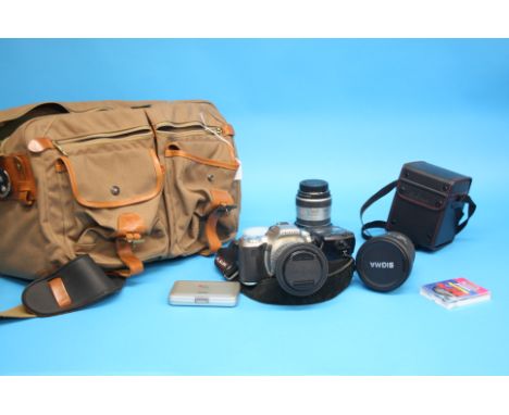 A Pentax ist dl camera with Pentax 28-90 lense, three Sigma lenses, 28-200mm, 12-24mm and 18-35mm, a flash light bag and acce