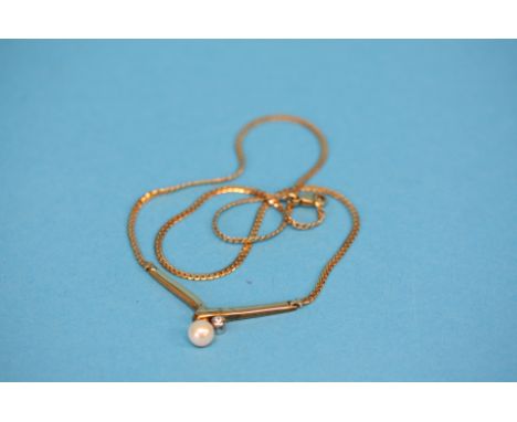 A 9ct gold pendant and chain set with cultured pearl.  Total weight 7.4 grams