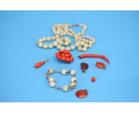 A silver and jade beaded bracelet, a jade necklace and a selection of coral jewellery.