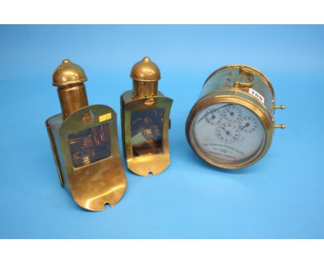 A Hateley's "Turners Patent" "The Homing Pigeon Clock" in a brass case, silvered dial; and a pair of oil lamps. (3)