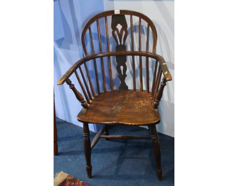 A stick back Windsor chair.