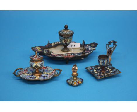 A collection of French cloisonne enamel decorated items to include an inkwell, pen and ink stand and two candle holders.