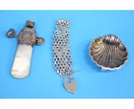 A mother of pearl Babies rattle with silver mount, Birmingham 1897, George Unite, a small shell silver salt, Chester 1893 and