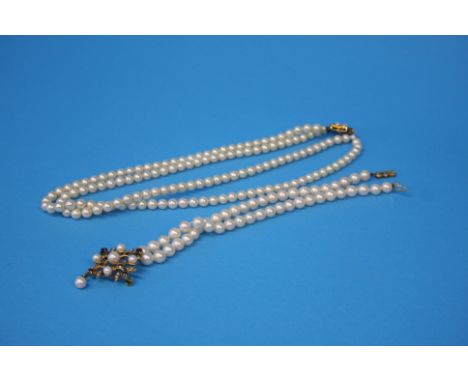 A double string of pearls with a 9ct gold fastener and a 9ct gold pearl set pendant attached pearl necklace.