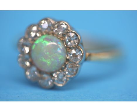 An Antique 18ct gold opal and diamond ring.  