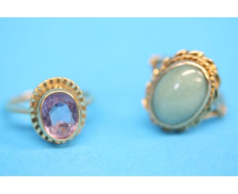 Two 9ct gold rings, one amethyst set, the other with oval green jade.  Ring size N and M.