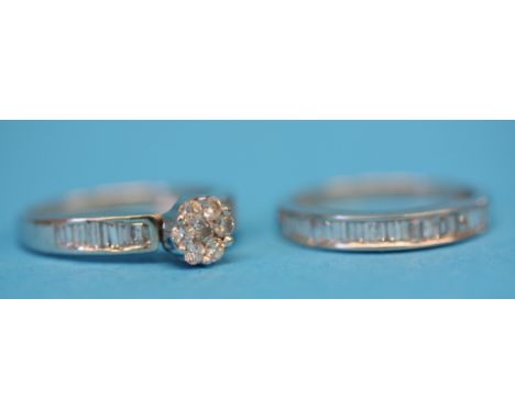 An 18ct white gold ladies diamond engagement ring and an 18ct white gold half hoop diamond eternity ring. (2)