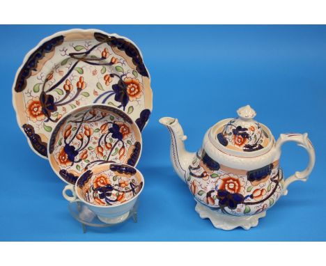 A Gaudy Welsh Victorian tea set comprising teapot, sucrier, slop bowl, 2 cake plates and 12 cups and saucers.