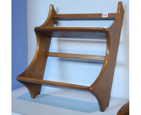 A small Ercol Golden Dawn two tier shelf.  43 cm wide