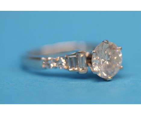 A solitaire diamond ring, approximately 1.8cts on diamond shoulders in 18ct white gold.