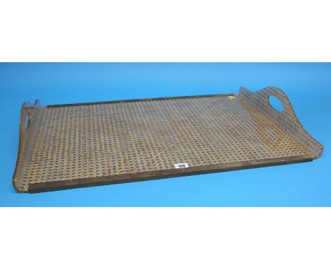 A 1970's Christian Dior Lucite tray with brass galleries and rattan cane-work.  50 cm wide, 72 cm long