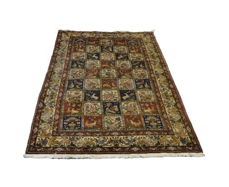 Persian tiled carpet, the field filled with nine rows of five tiles with birds, animals, and flowers, running deer and bird b