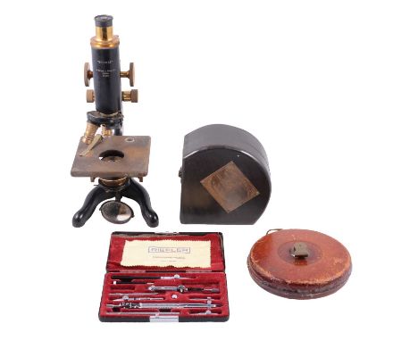 A microscope with objectives; Riefler and other cased drawing instruments, a Rabone leather cased reel; a Smith &amp; Co 1930