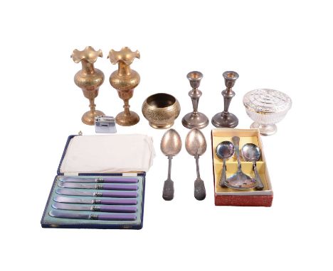 A pair of silver candlesticks, weighted; pair of silver-plated dwarf candlesticks; three-piece condiments set on a tray; two 