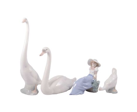 Lladro and Nao models, including swan, 5230, 21cm, three Nao figures including two ducks and a seated girl with bird.Qty: 4