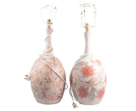 Near pair of modern stoneware lamp bases, bottle necks, painted with flowerheads, height (including fittings) 57cm, and 54cm.