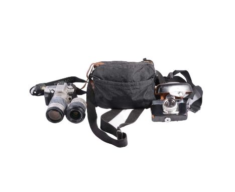 Cameras, including Minolta AL-F with lens, Dynax 5 with AF Zoom lens, folding camera, etc. in a bag.