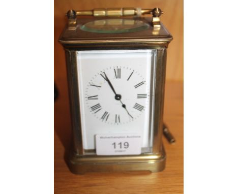 A BRASS CARRIAGE CLOCK AND KEY 