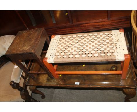 A GLASS TOPPED COFFEE TABLE TOGETHER WITH A STOOL, AND A SMALL TABLE 