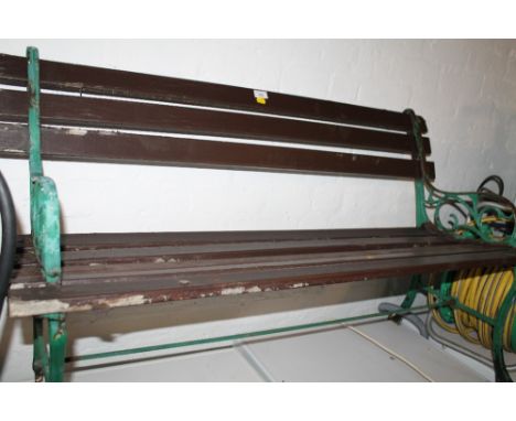 A SMALL GARDEN BENCH WITH METAL ENDS 