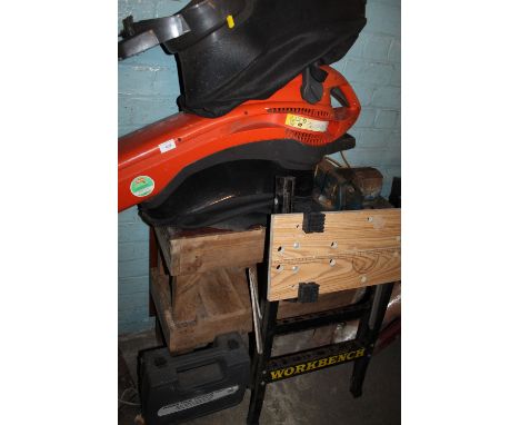 A FLYMO GARDEN VAC TOGETHER WITH A BENCH AND VICE PLUS A WORK BENCH 