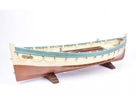 A large scale model of a SS Titanic life boat, constructed in wood and finished in brown, blue and cream with Qars, Mast, Sai