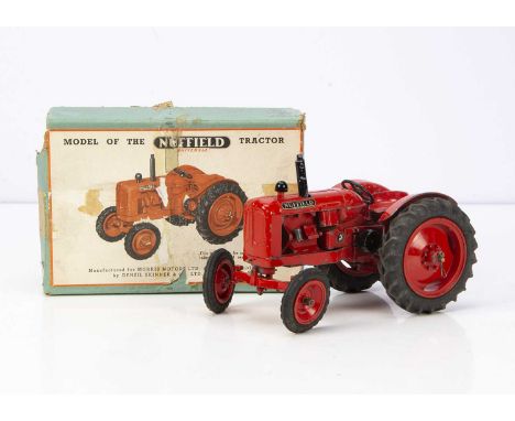 A Denzil Skinner Large Nuffield Universal Tractor, orangey-red mazak body and wheels, rubber tyres, 'Nuffield Universal' deca