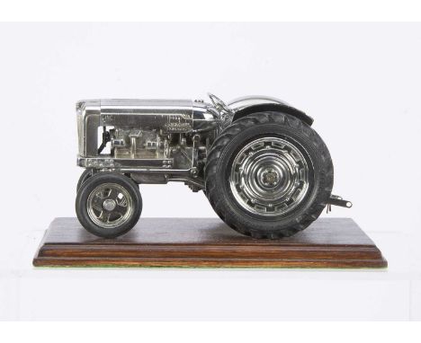 A Chad Valley No.M87 Chrome Plated New Fordson Major Tractor, chrome plated diecast body, tinplate bonnet and wheels, non-mec