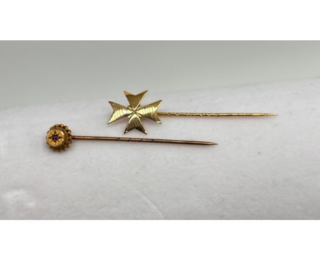 Two yellow metal stick pin brooches, one marked 9ct with centre stone, other hallmarked but faded